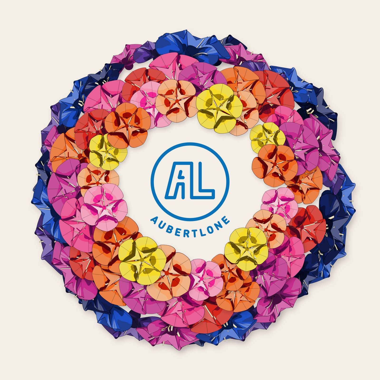 A wreath of paper flowers in a hue sweep on paper, open in the middle