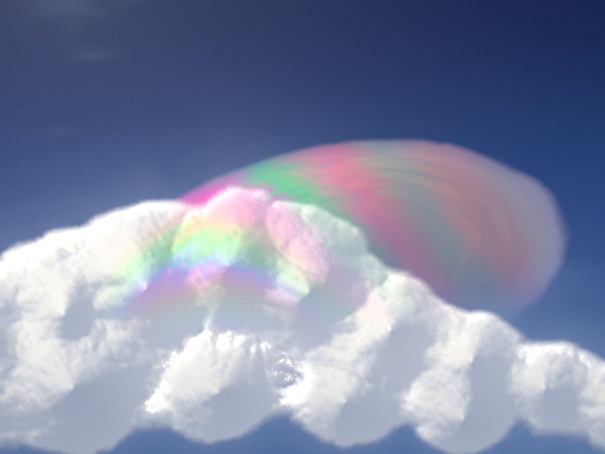 Shader frame: a soft cumulus with a translucent iridescent cap, pink and green bands