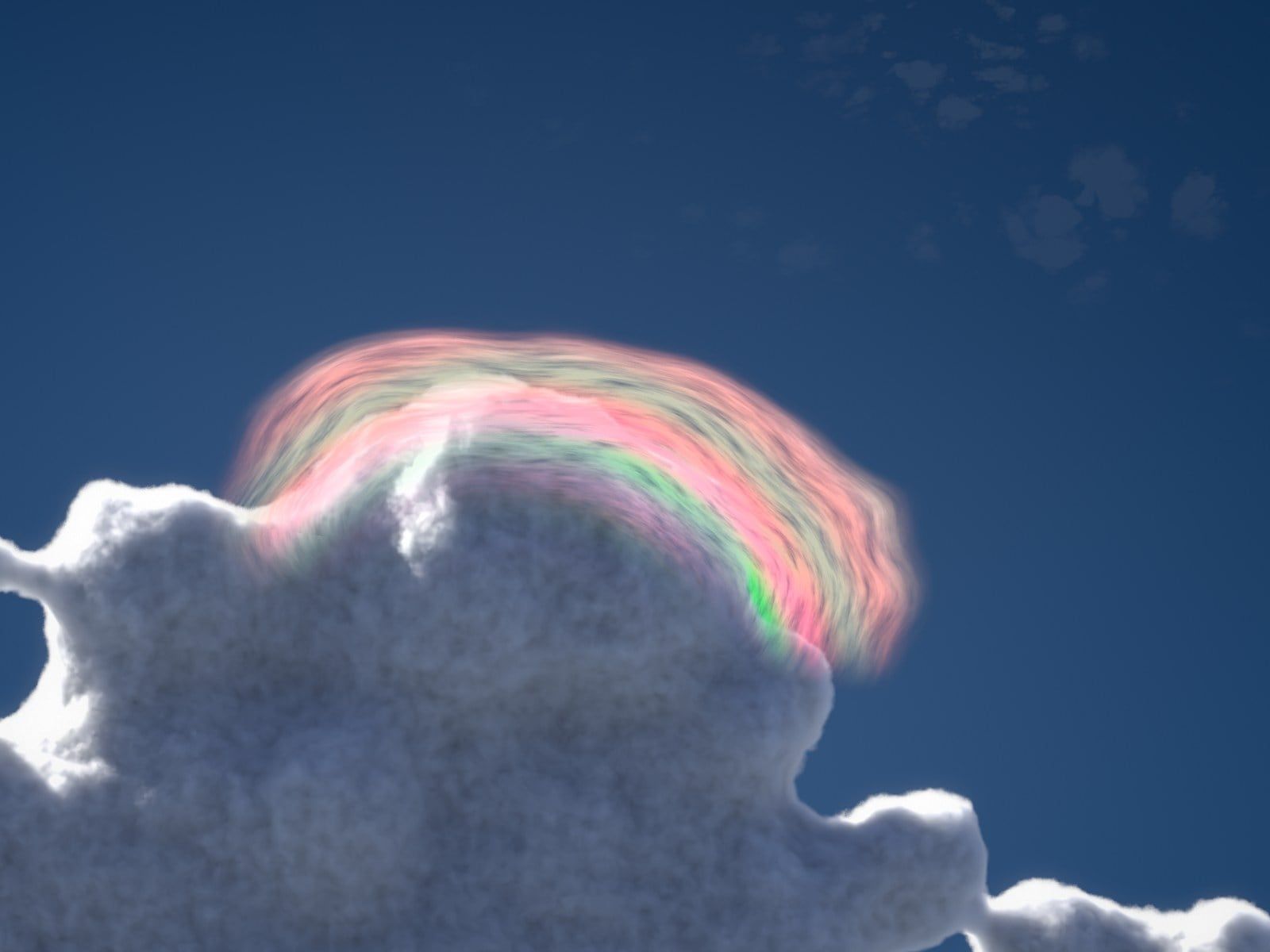A sunlit cumulus tower under a thin cap of cloud whose pink and green colour bands follow the cap’s curve against a deep blue sky