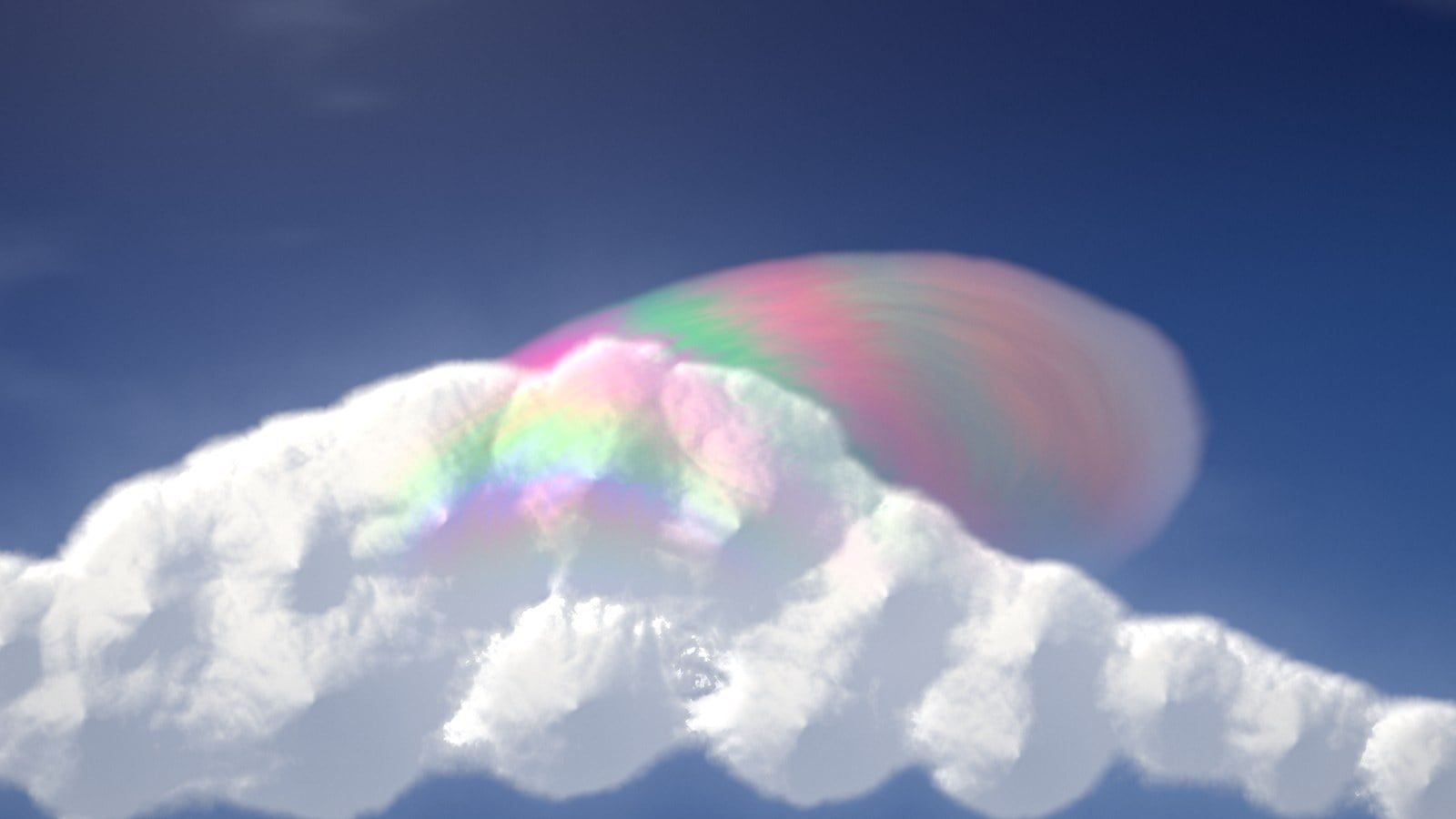 A frame of the live pileus shader: a soft cumulus tower with a translucent iridescent cap, pink and green bands curving over its shoulder